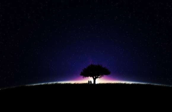 Couple under a tree on a glowing field