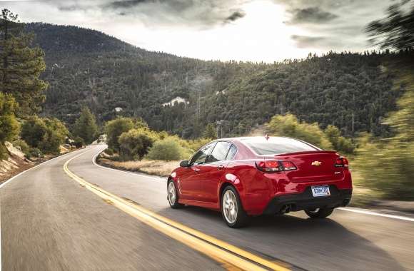 2015 Red Chevrolet SS along the forest
