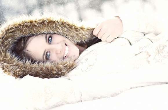 Girl with blue eyes lying in the snow wallpapers hd quality
