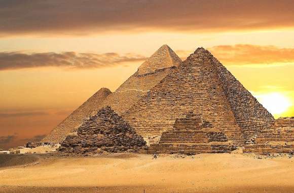 sunset in giza with pyramids