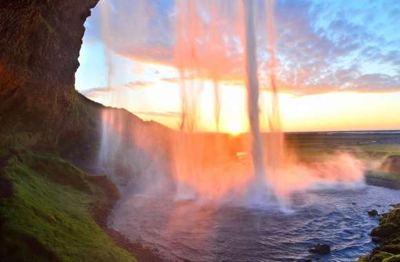 Tall waterfall in the sunset