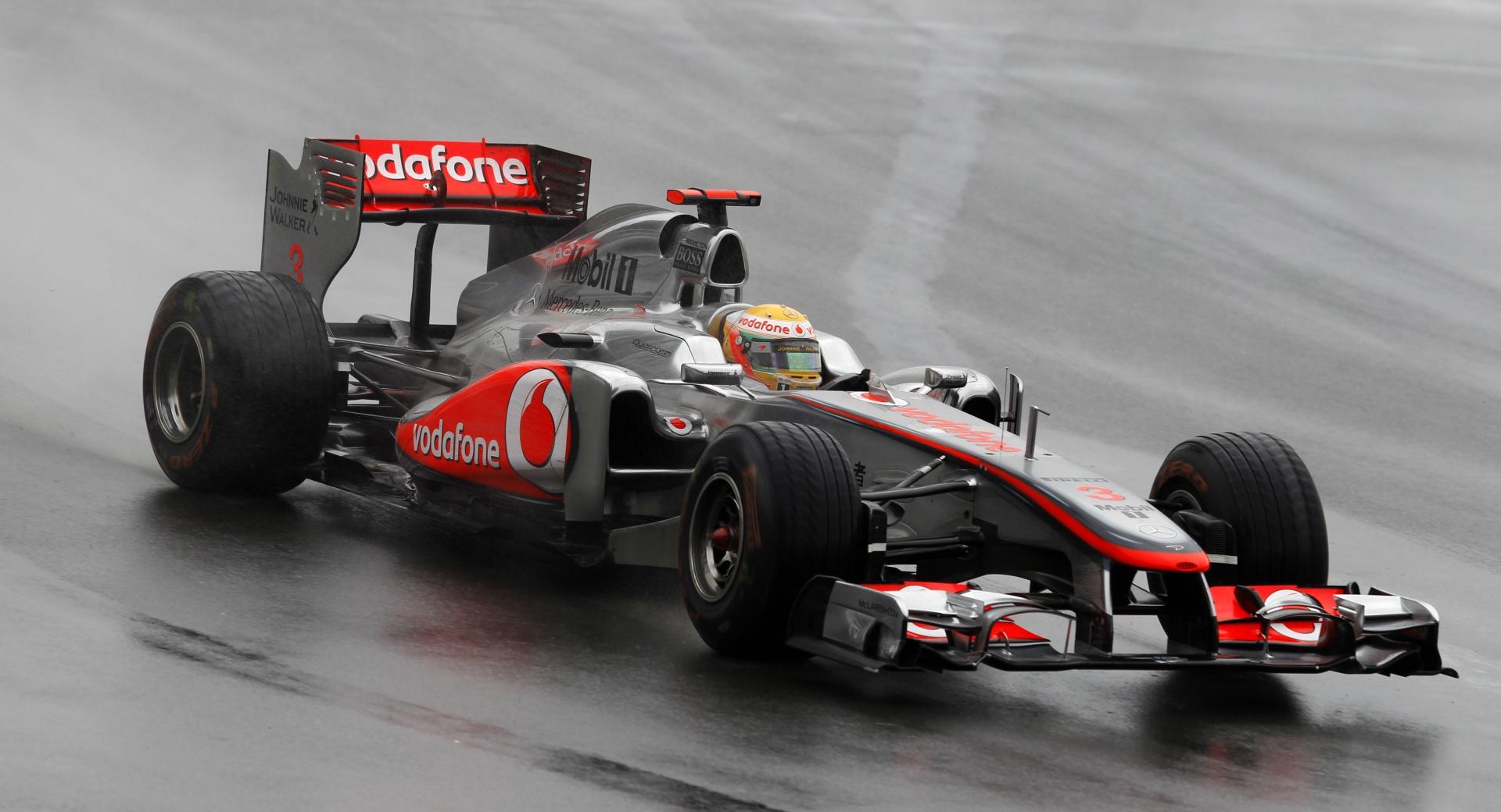 F1 Car On A Wet Track at 1024 x 1024 iPad size wallpapers HD quality