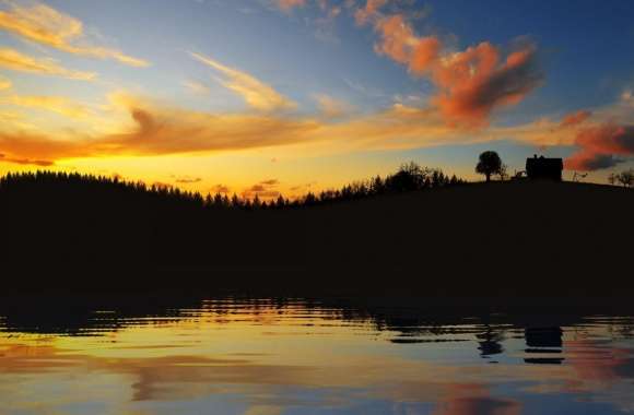 Sunset Glow Beyond A Lake At Twilight