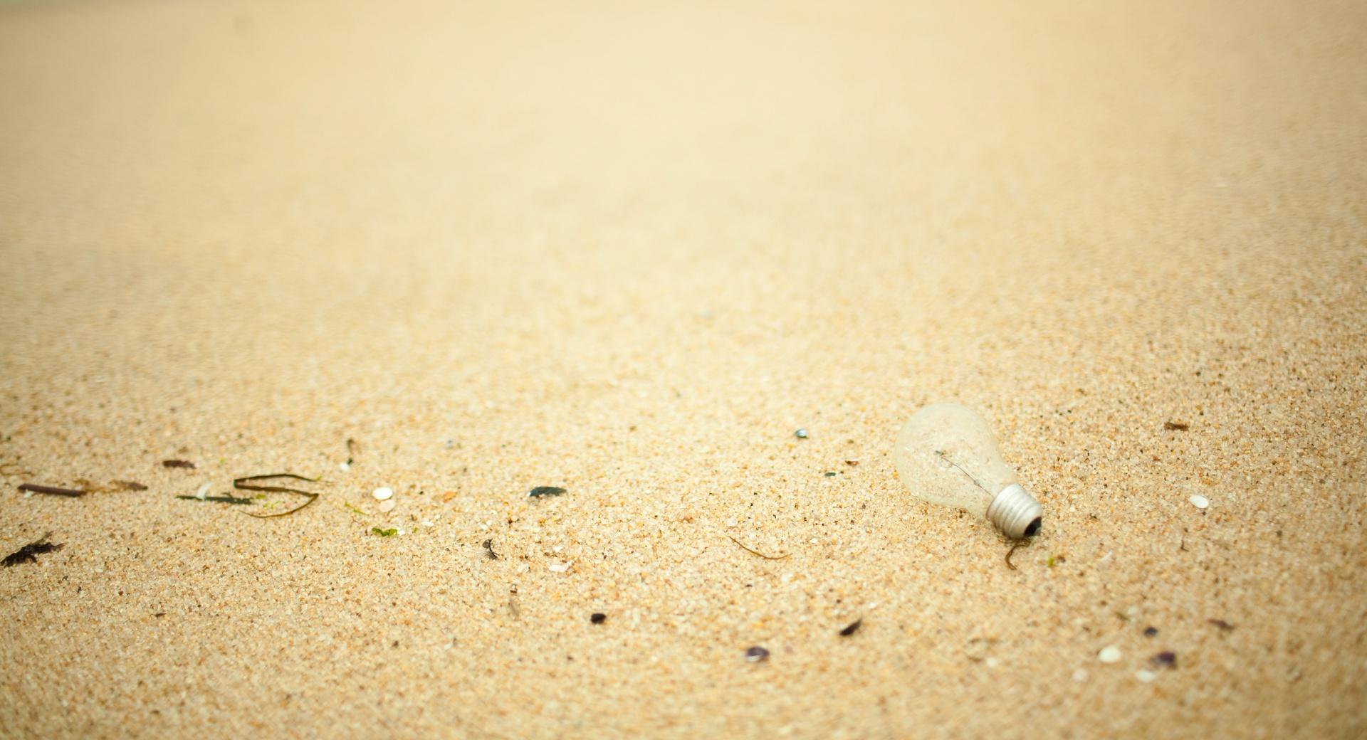 Light Bulb On Sand at 640 x 960 iPhone 4 size wallpapers HD quality