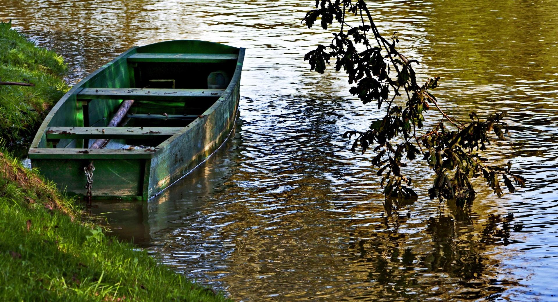 Empty Boat at a River Bank in Slovenia at 640 x 1136 iPhone 5 size wallpapers HD quality
