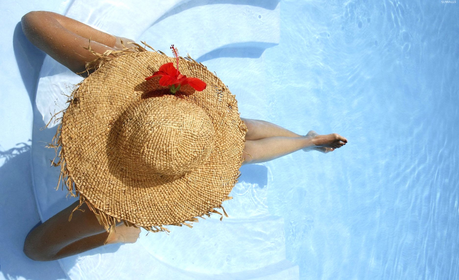 Girl with a hat sitting in the pool at 640 x 1136 iPhone 5 size wallpapers HD quality