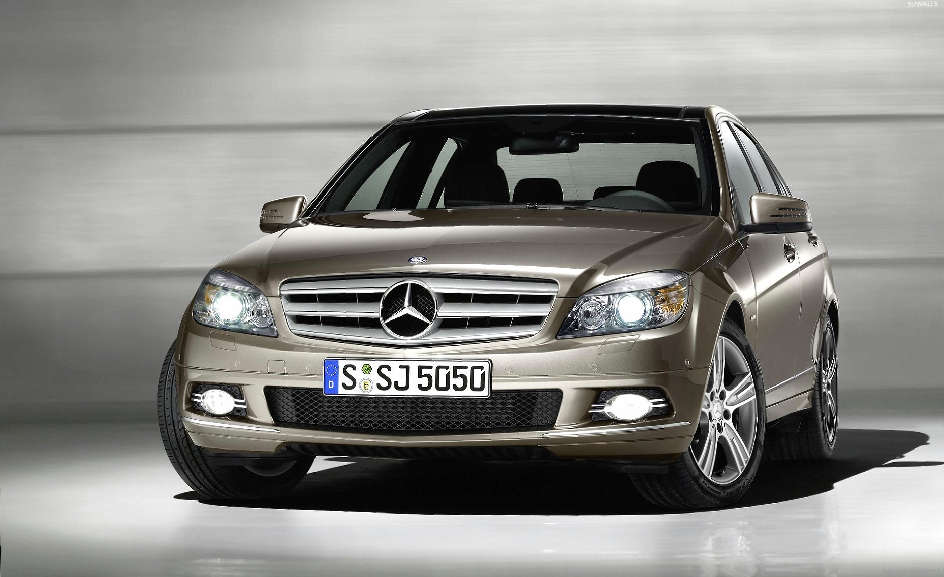Mercedes-Benz C-Class front view with headlights on at 320 x 480 iPhone size wallpapers HD quality
