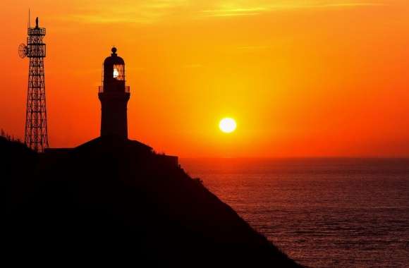 Lighthouse Silhouette At Sunset
