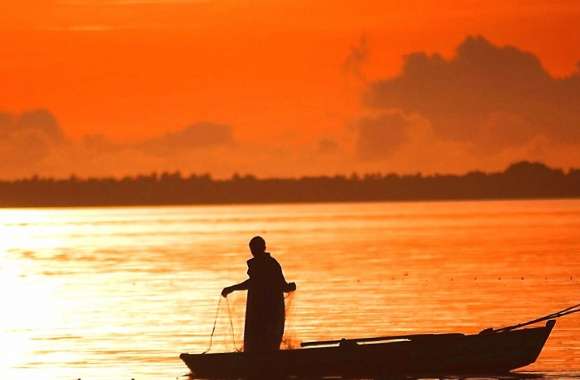 Orange sunset fisherman boat sea