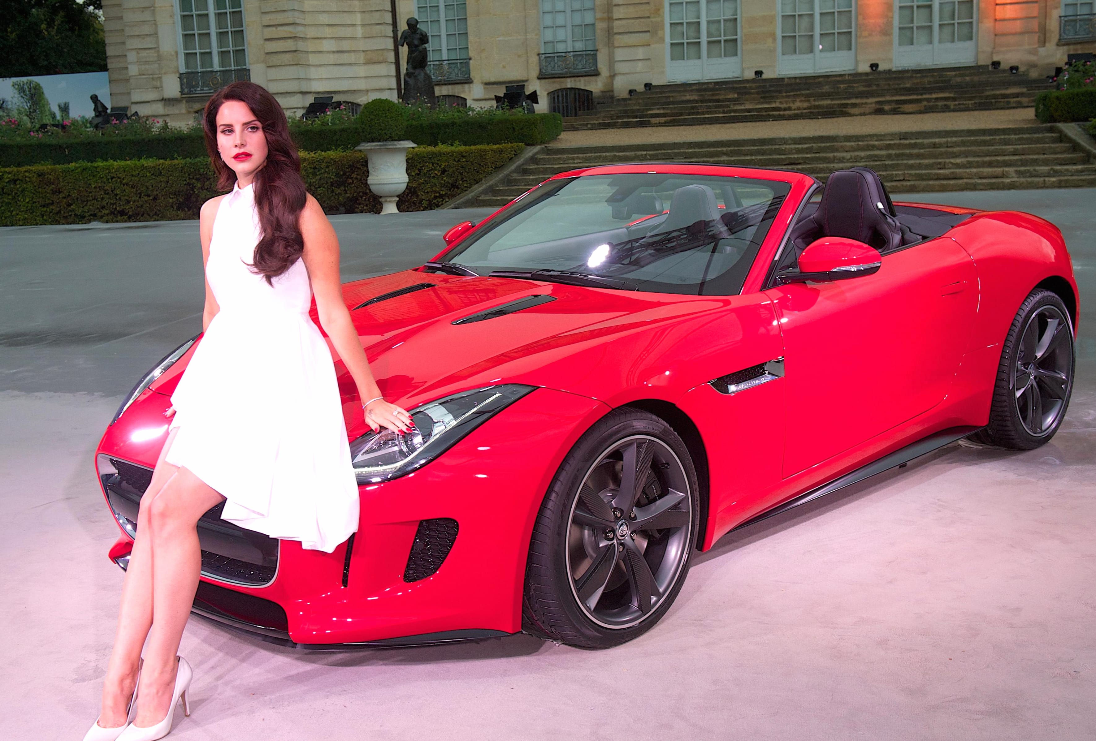 Lana Del Rey with a Stunning Car - at 320 x 480 iPhone size wallpapers HD quality