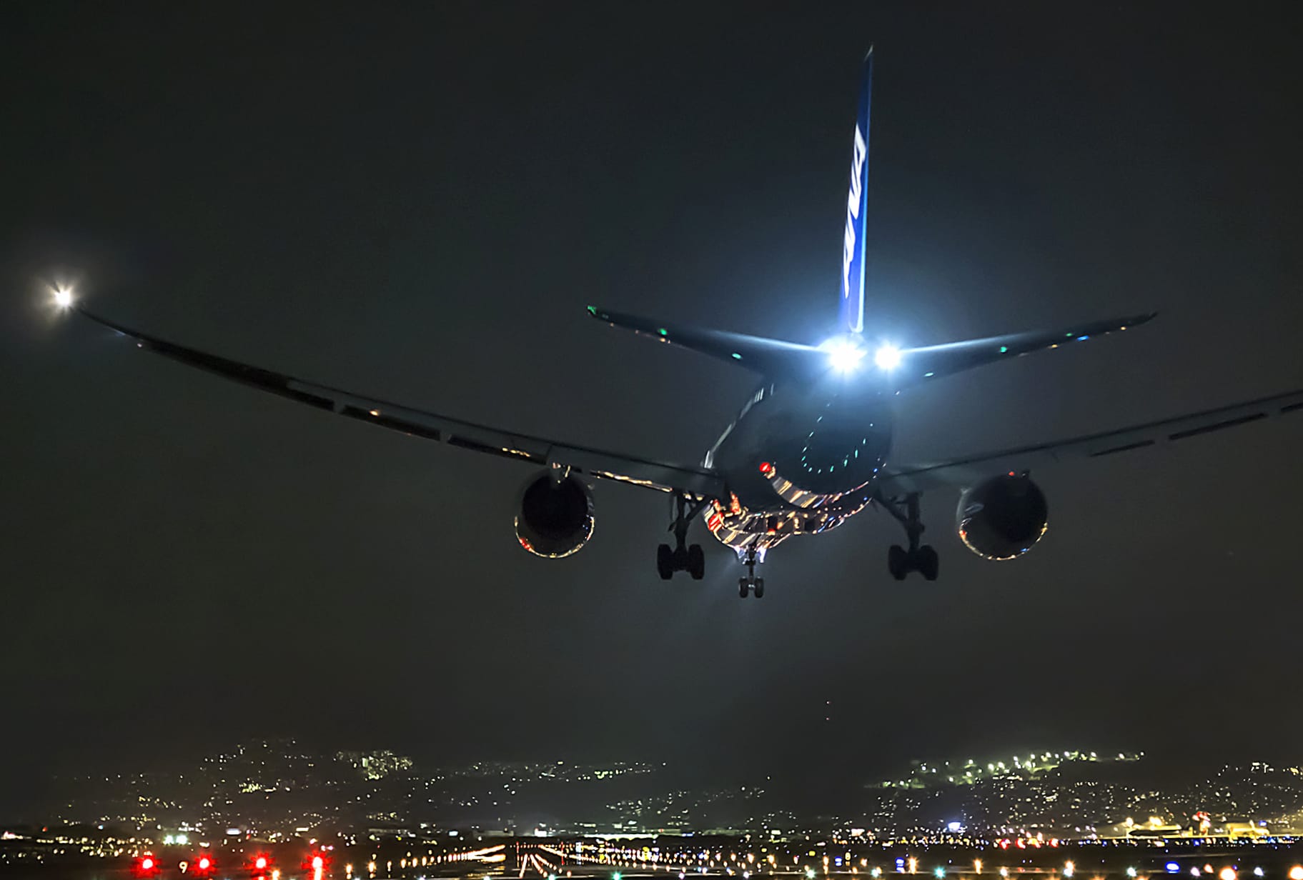 Nighttime Cityscape of Aircraft in Flight at 1280 x 720 HD size wallpapers HD quality