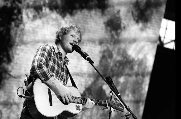 4K Black & White English Singer with Guitar Wallpaper