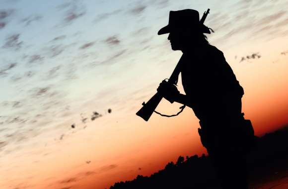 Red Dead Redemption-Inspired Cowboy Silhouette at Sunset wallpapers hd quality