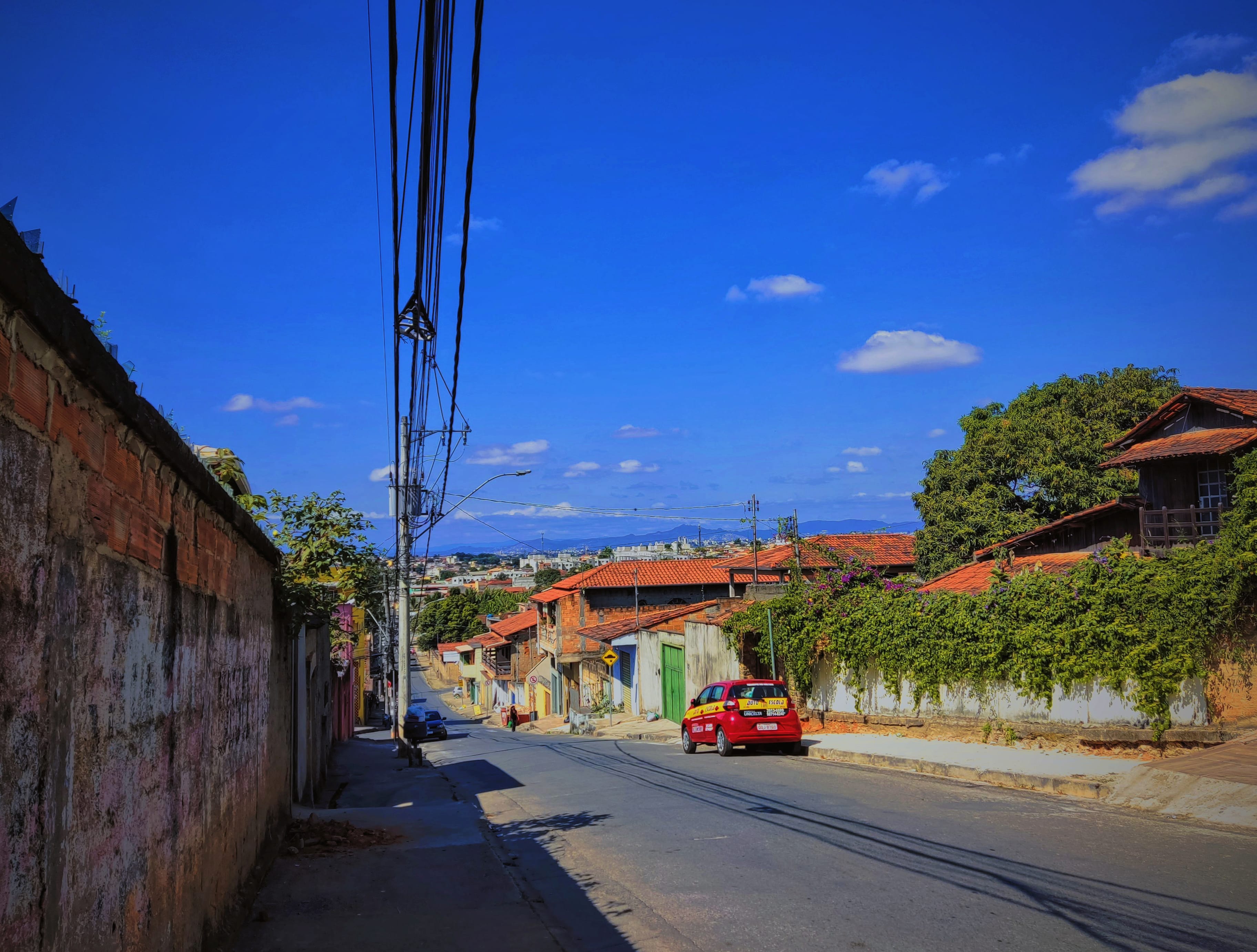 A car driving down a street wallpapers HD quality