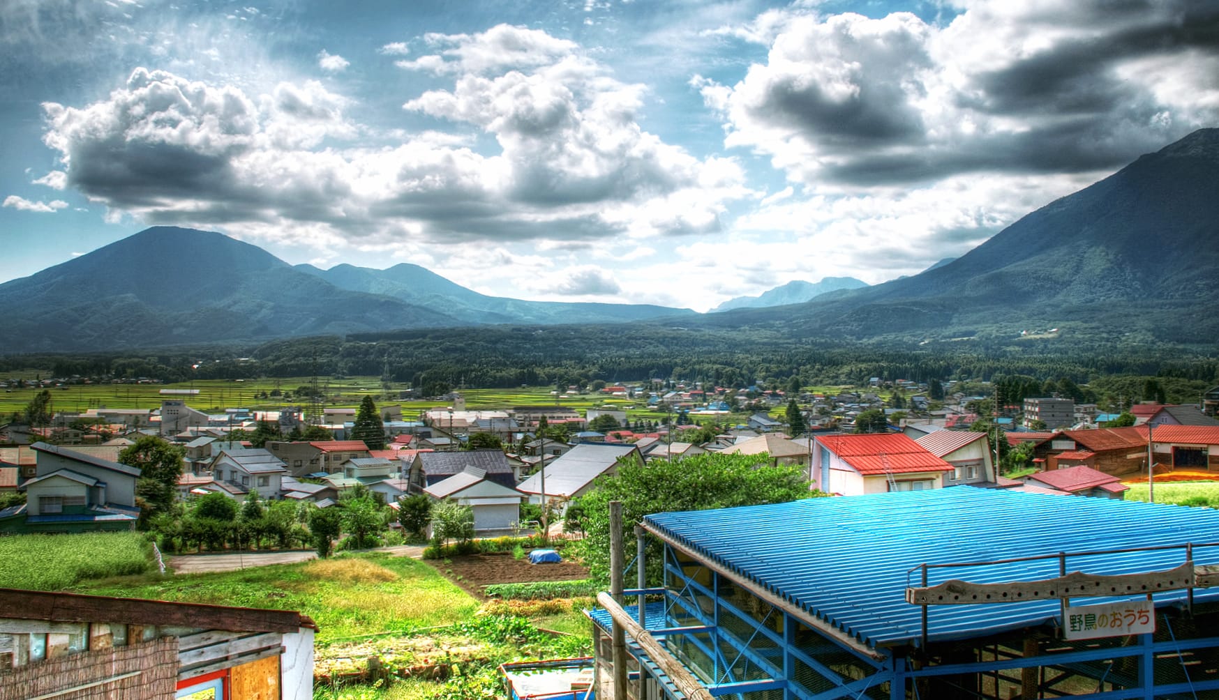 Sunny Village Landscape Mountains, Clouds, and Community Charm wallpapers HD quality