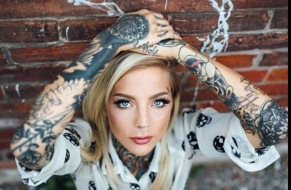 Blonde Tattooed Model with Blue Eyes -