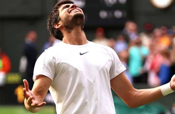 Carlos Alcaraz celebrates beating Novak Djokovic to win his first Wimbledon