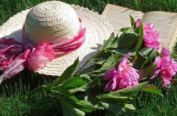 Charming Still Life of a Hat, Flowers, and a Book