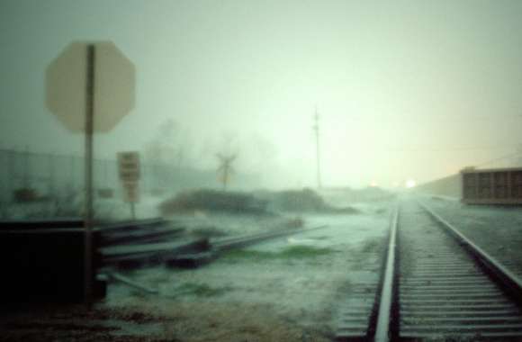 HD Wallpaper of a Mysterious Railyard at Dusk