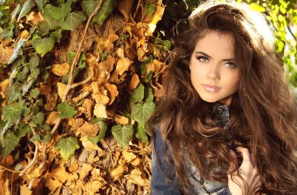 Model Amidst Autumn Leaves