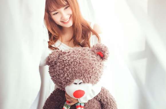 Smiling Brunette with Teddy Bear -