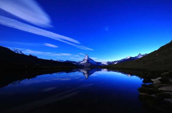 Starry Reflection A Stunning of Mountains and Lake at Night