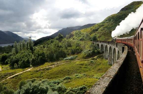 Steam train on the Glenfinnan viaduct, Scotland